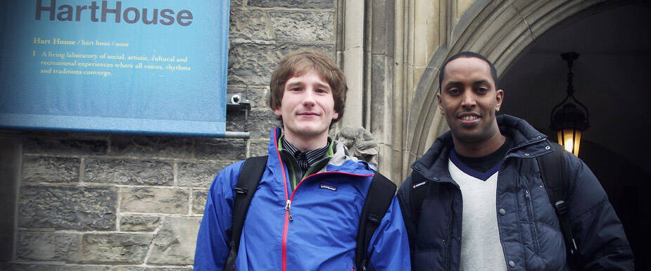 2 young men standing for a pose